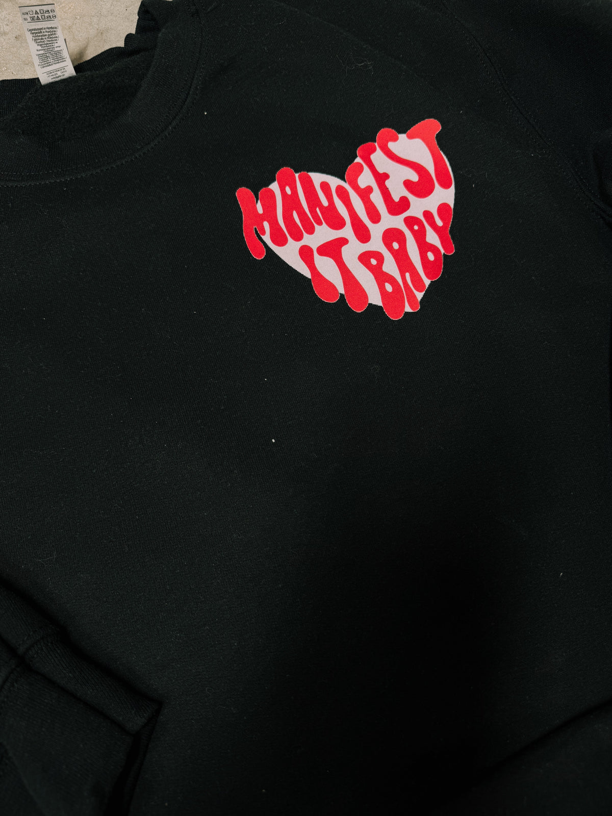 Manifest It, Baby – Black Hanes Crewneck (Front & Back Print) | WHOLESALE